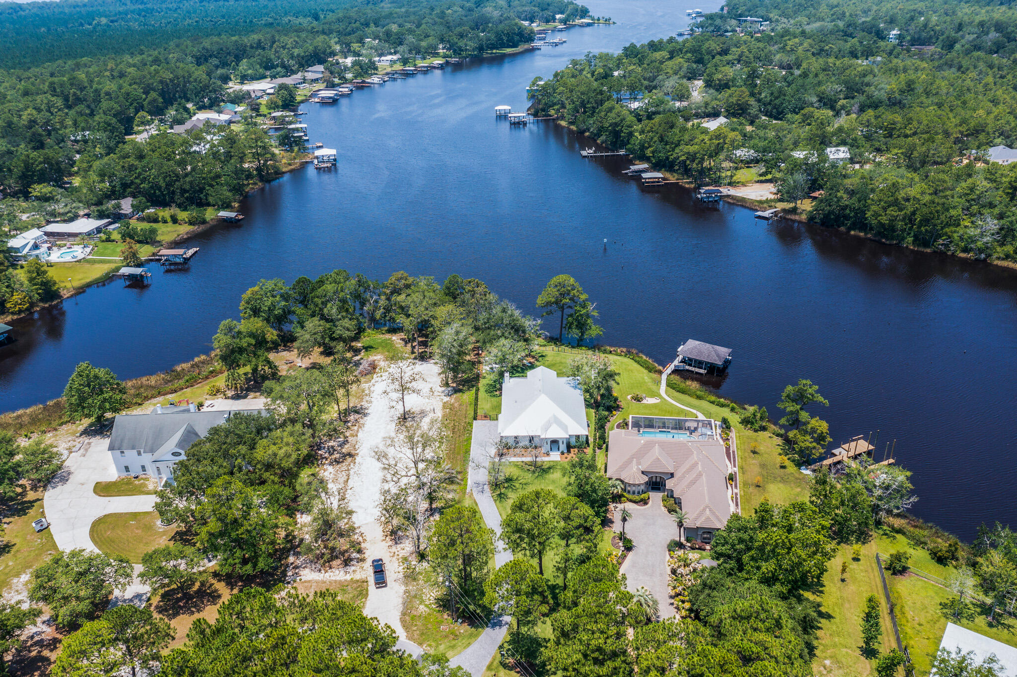 648 Mallet Bayou Road Freeport, FL 32439 - Photo 12 of 86 an aerial view of a house with a yard and lake view