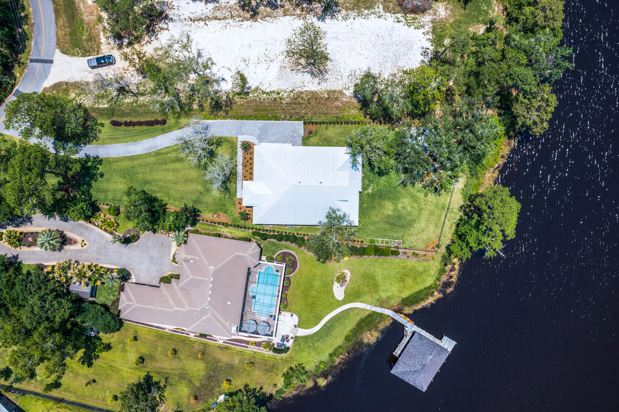 648 Mallet Bayou Road Freeport, FL 32439 - Photo 15 of 86 an aerial view of a house with outdoor space pool seating area and yard