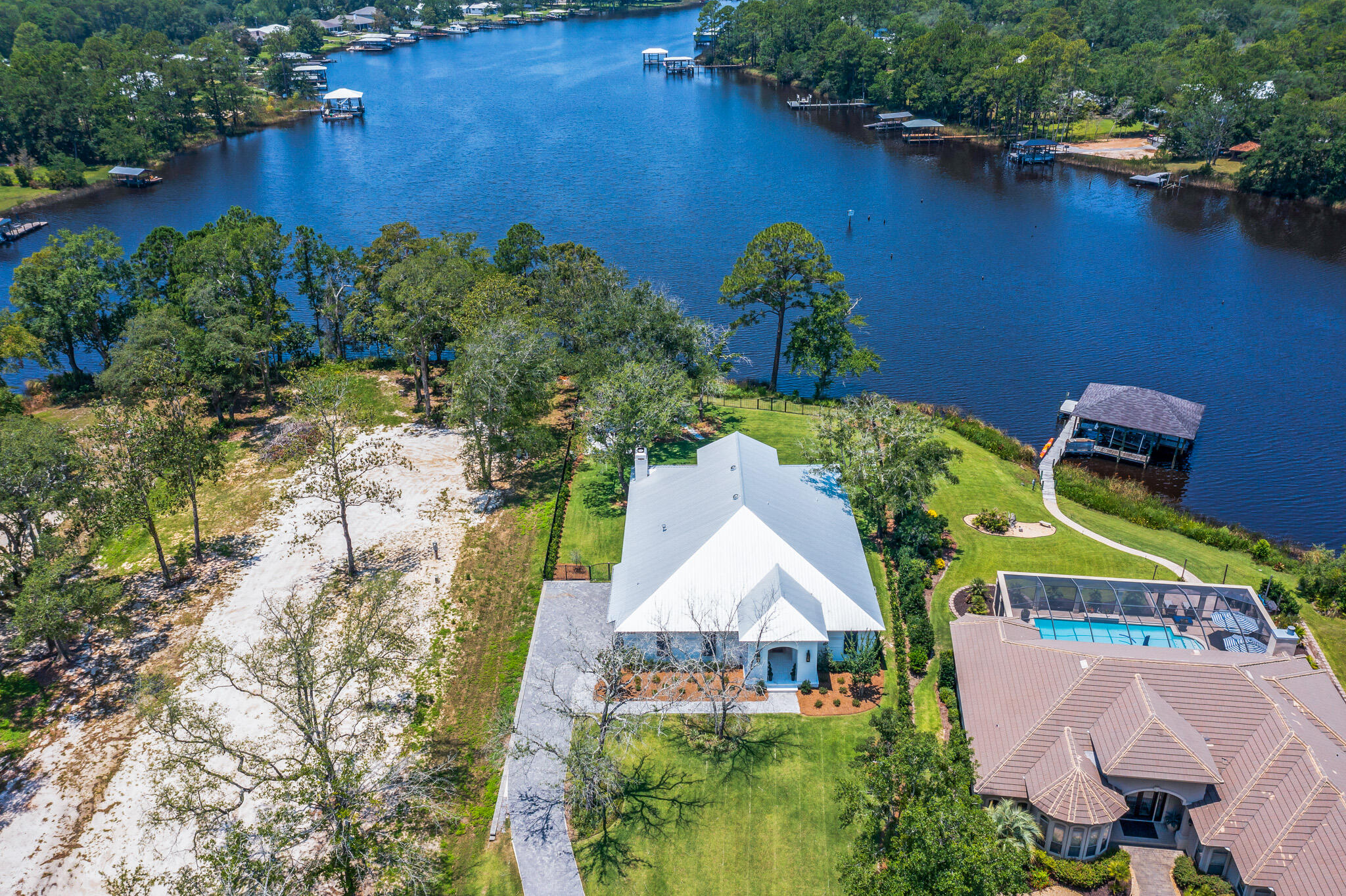 648 Mallet Bayou Road Freeport, FL 32439 - Photo 18 of 86 an aerial view of a house with a yard and lake view