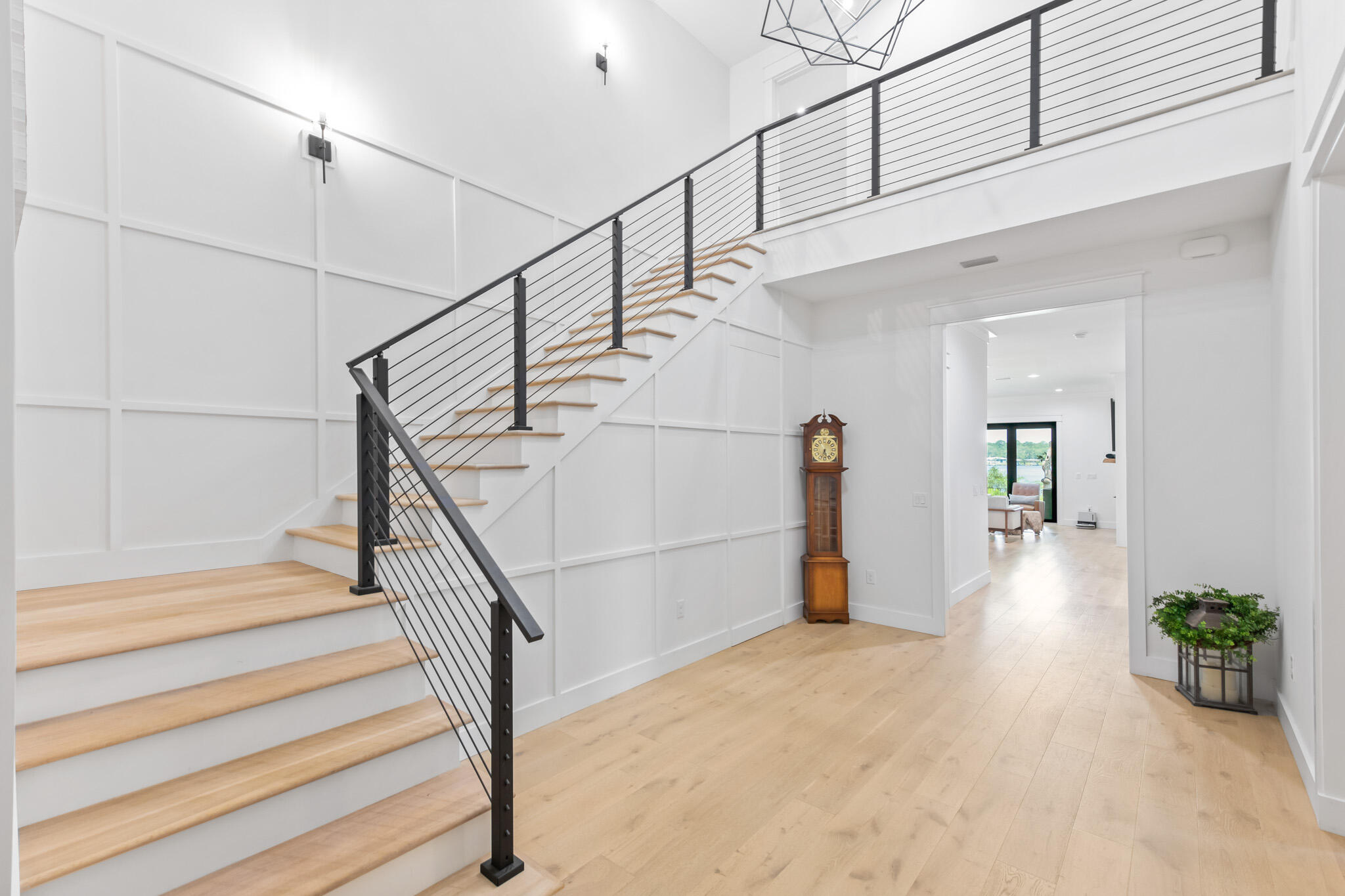 648 Mallet Bayou Road Freeport, FL 32439 - Photo 35 of 86 a view of staircase with lots of frames on wall and a window