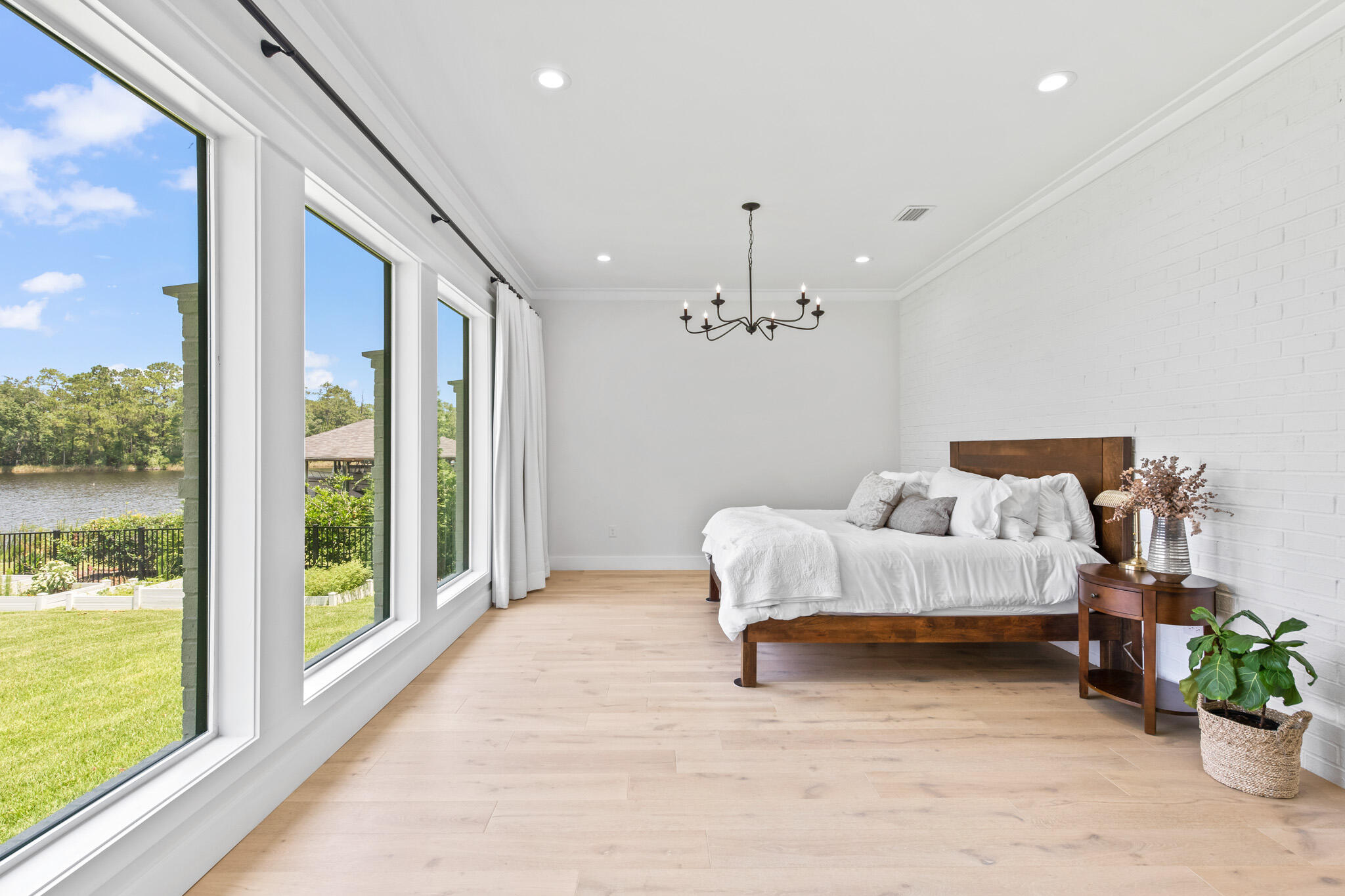 648 Mallet Bayou Road Freeport, FL 32439 - Photo 51 of 86 a bed room with a bed and a chandelier