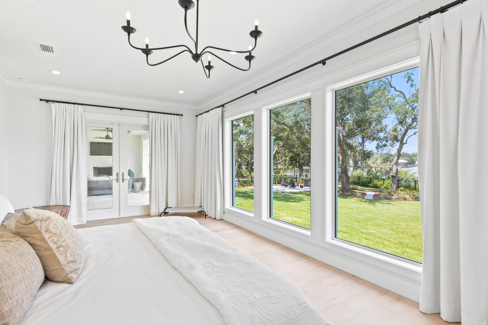 648 Mallet Bayou Road Freeport, FL 32439 - Photo 53 of 86 a bedroom with a large bed and a large window