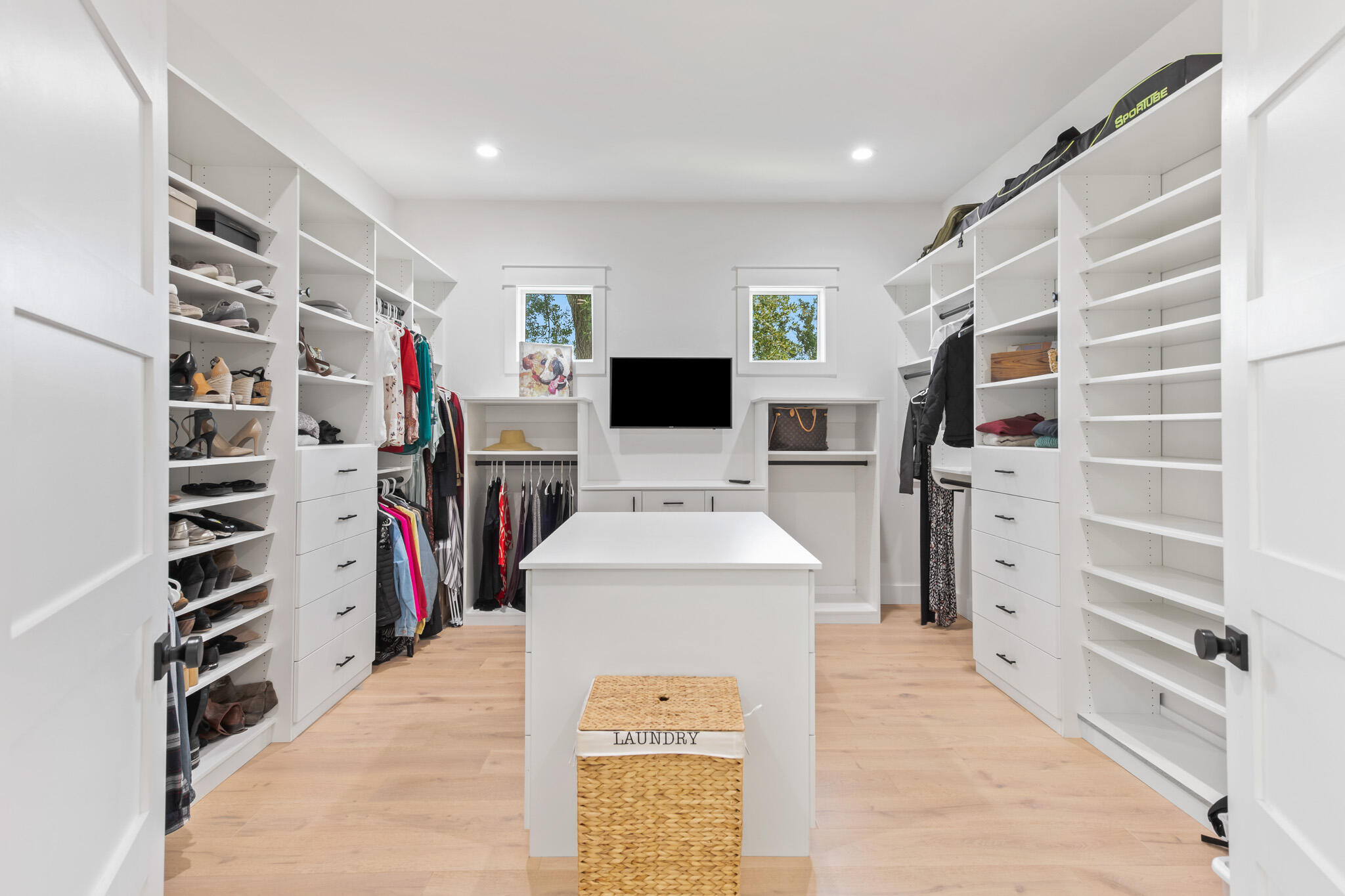 648 Mallet Bayou Road Freeport, FL 32439 - Photo 54 of 86 a view of walk in closet with clothes and shoes