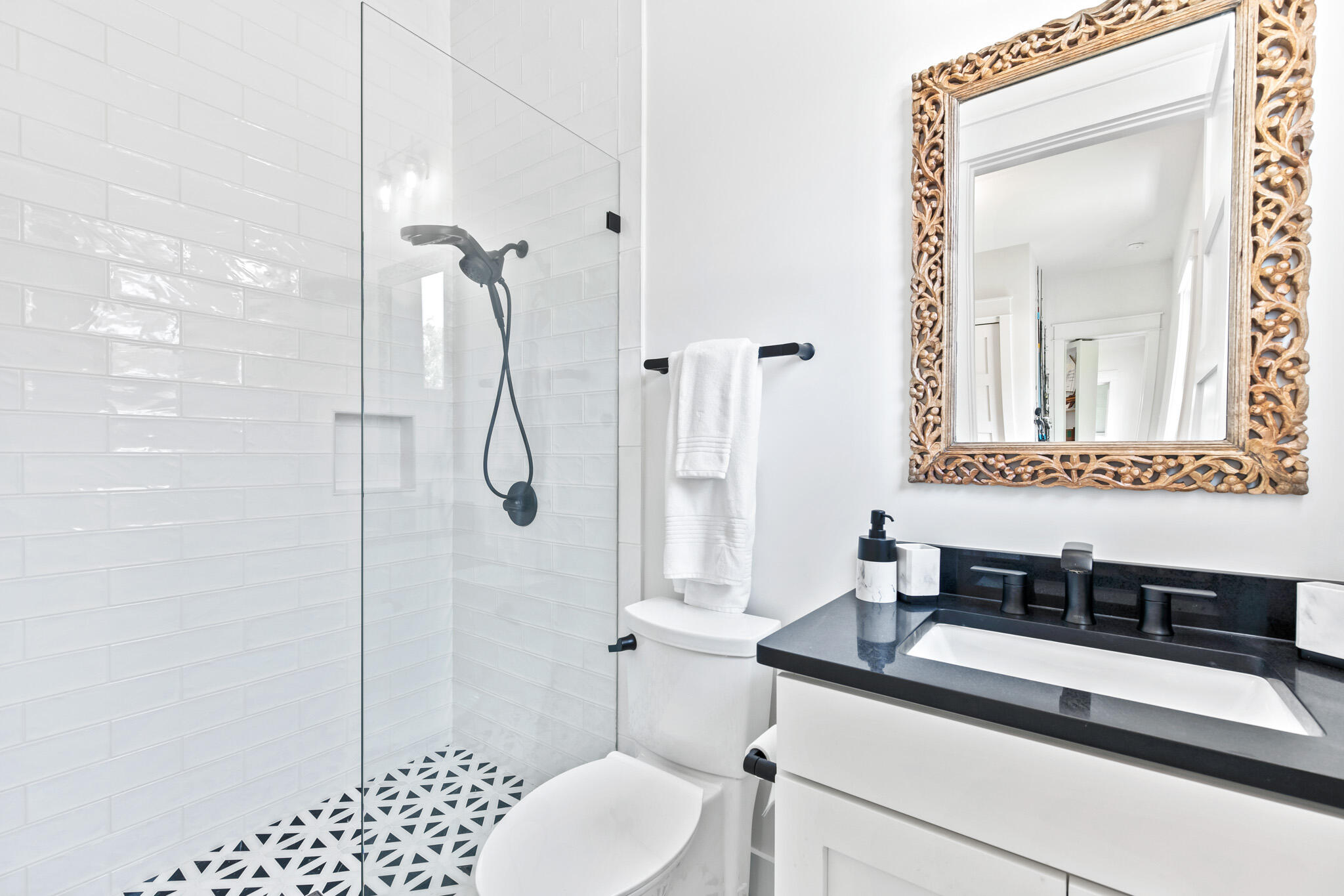 648 Mallet Bayou Road Freeport, FL 32439 - Photo 63 of 86 a bathroom with a granite countertop sink a toilet and shower
