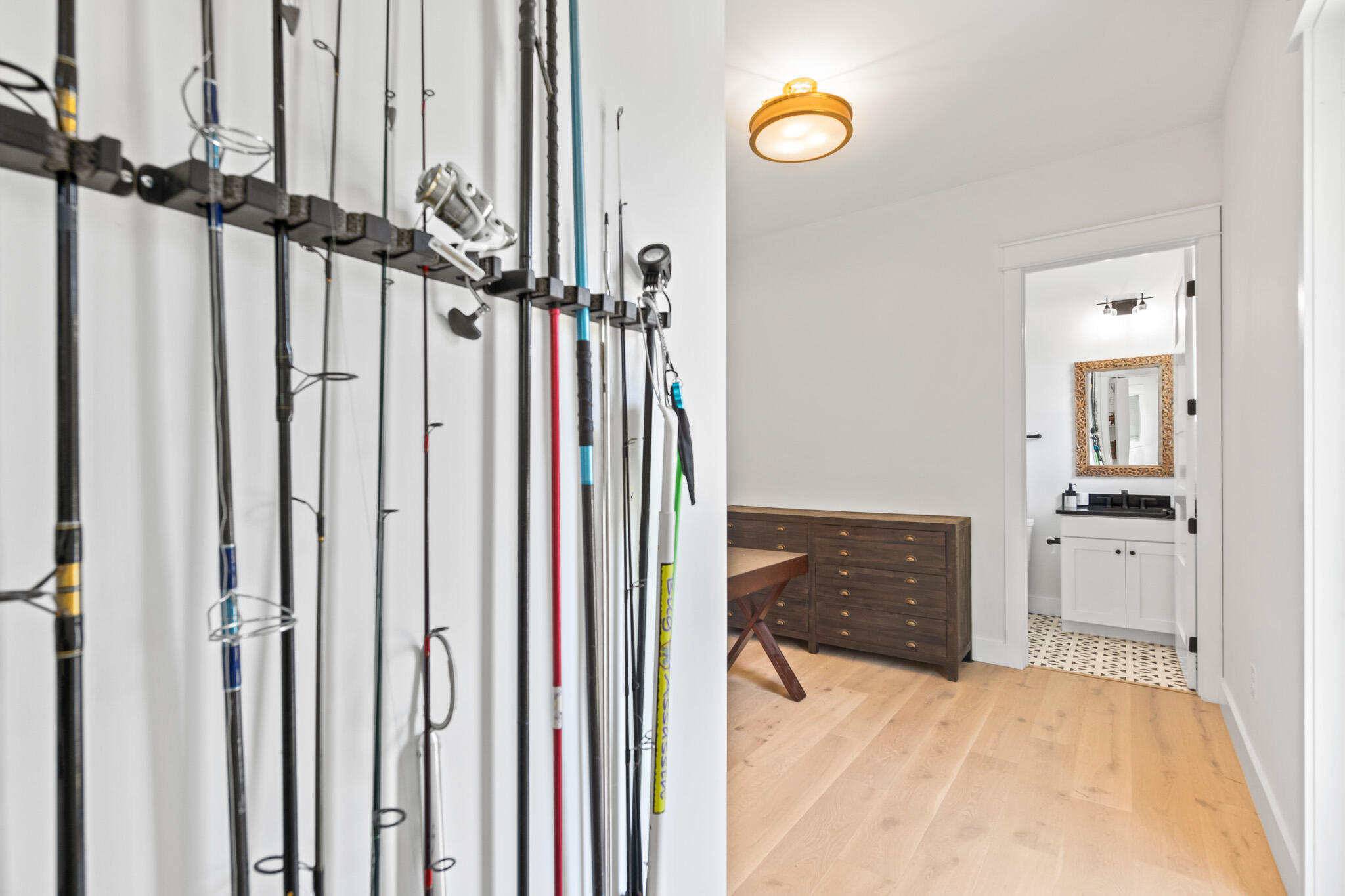 648 Mallet Bayou Road Freeport, FL 32439 - Photo 66 of 86 a view of a hallway with wooden floor and windows