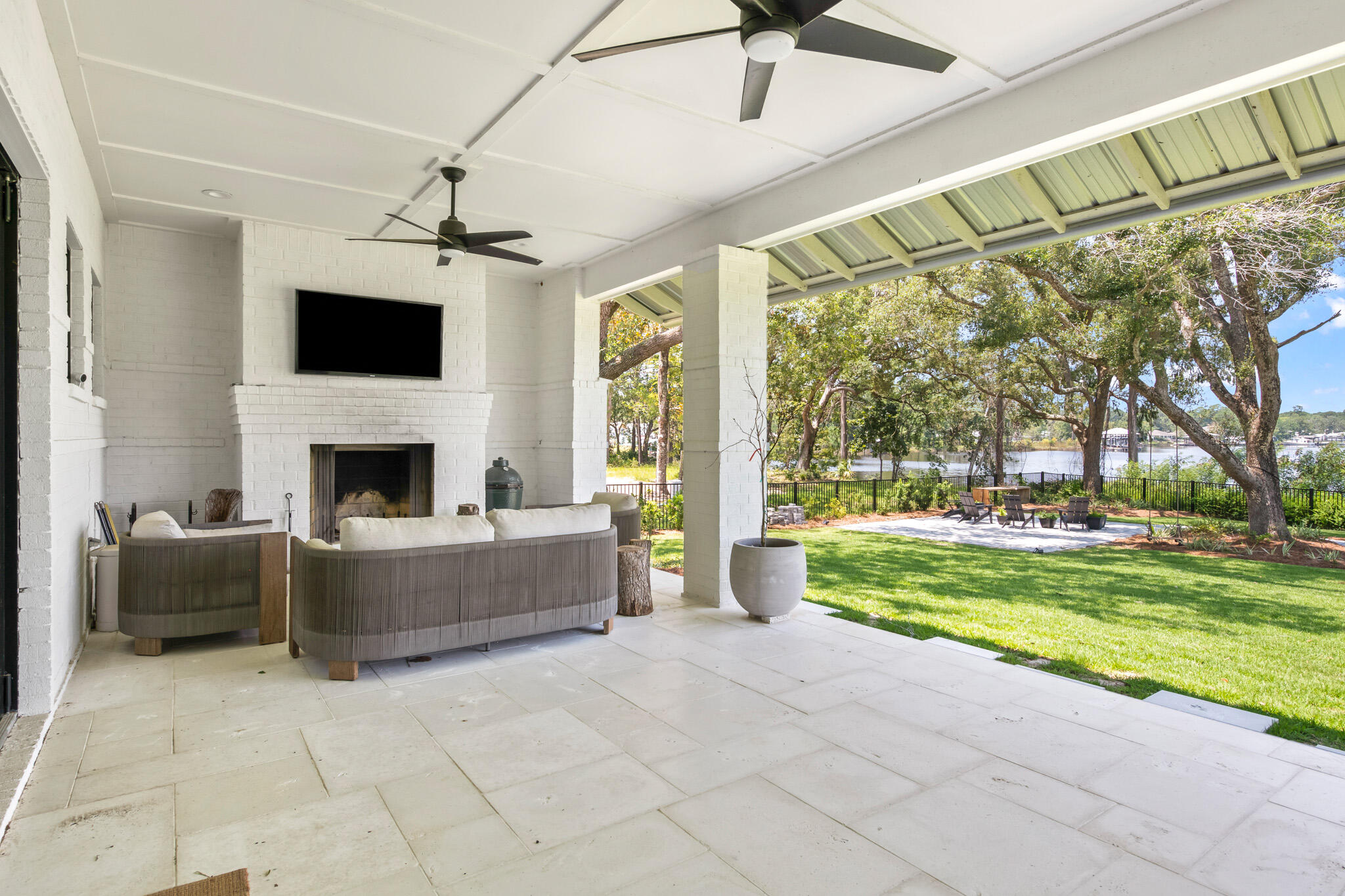 648 Mallet Bayou Road Freeport, FL 32439 - Photo 67 of 86 a living room with a couch a flat screen tv and a fireplace