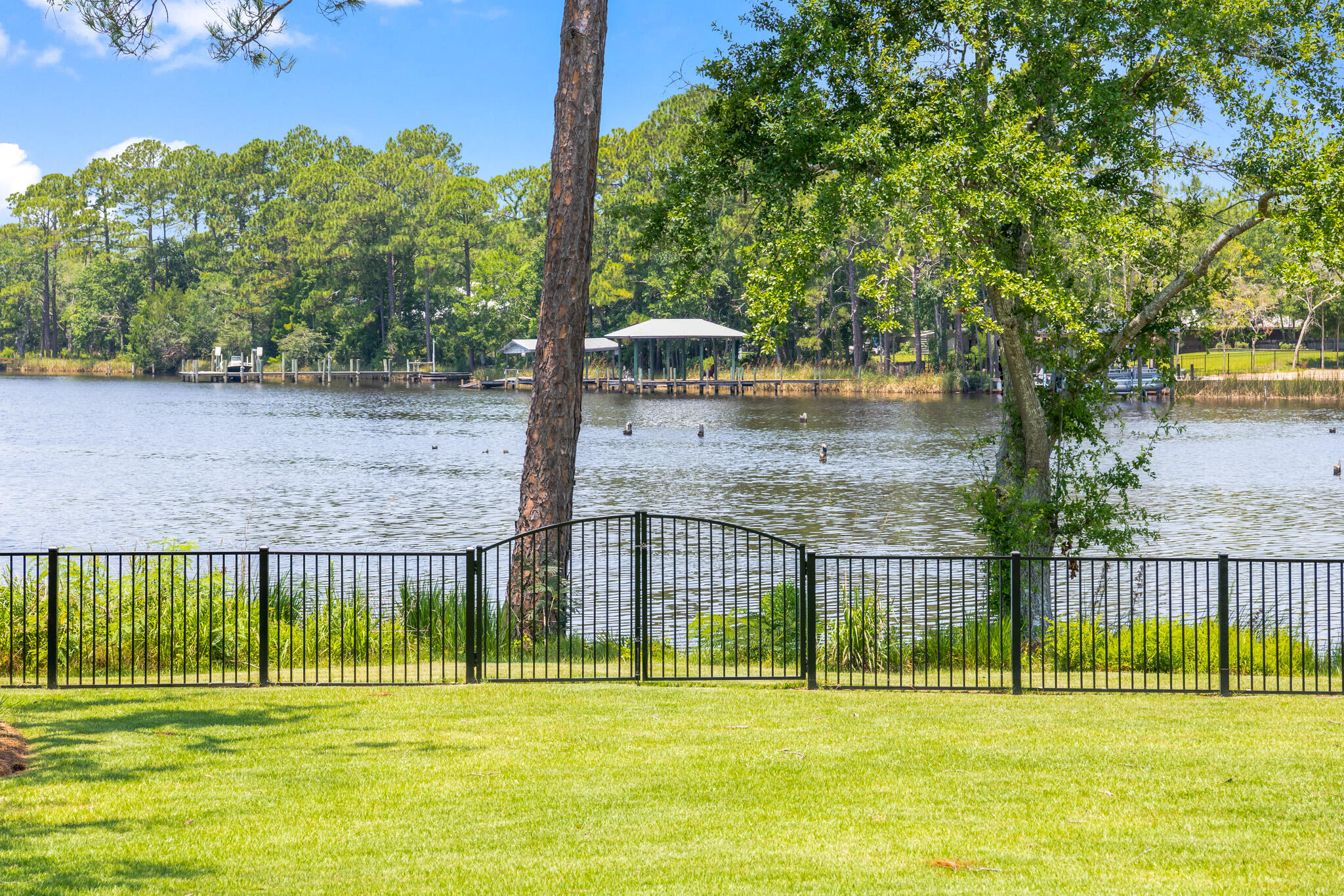 648 Mallet Bayou Road Freeport, FL 32439 - Photo 79 of 86 a view of a house with a big yard and a large tree