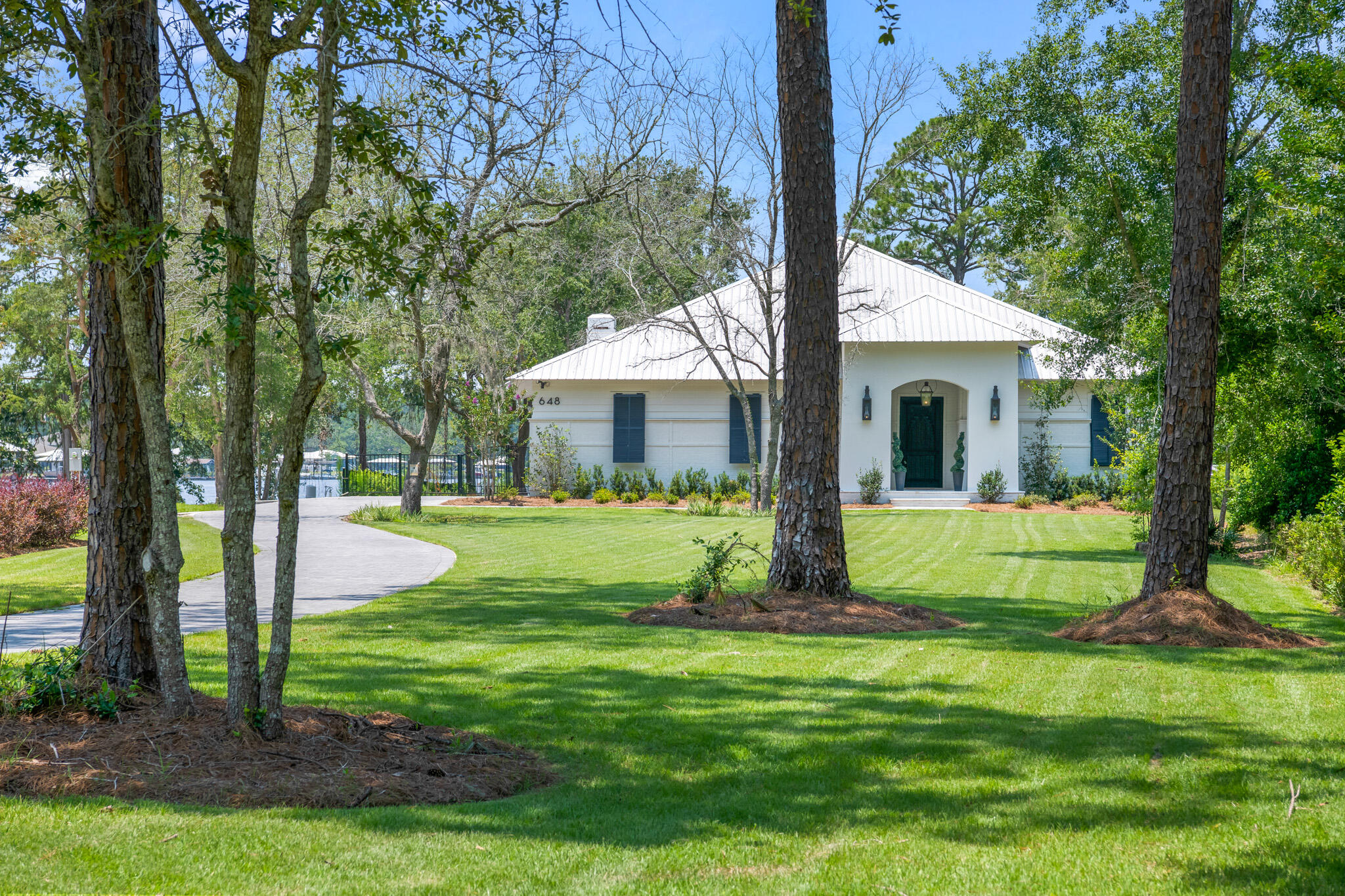 648 Mallet Bayou Road Freeport, FL 32439 - Photo 85 of 86 a view of a house with a backyard and a tree