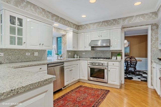 275 Coachmaker Road Northbrook, IL 60062 - Photo 8 of 33 a kitchen with stainless steel appliances granite countertop a stove and a sink
