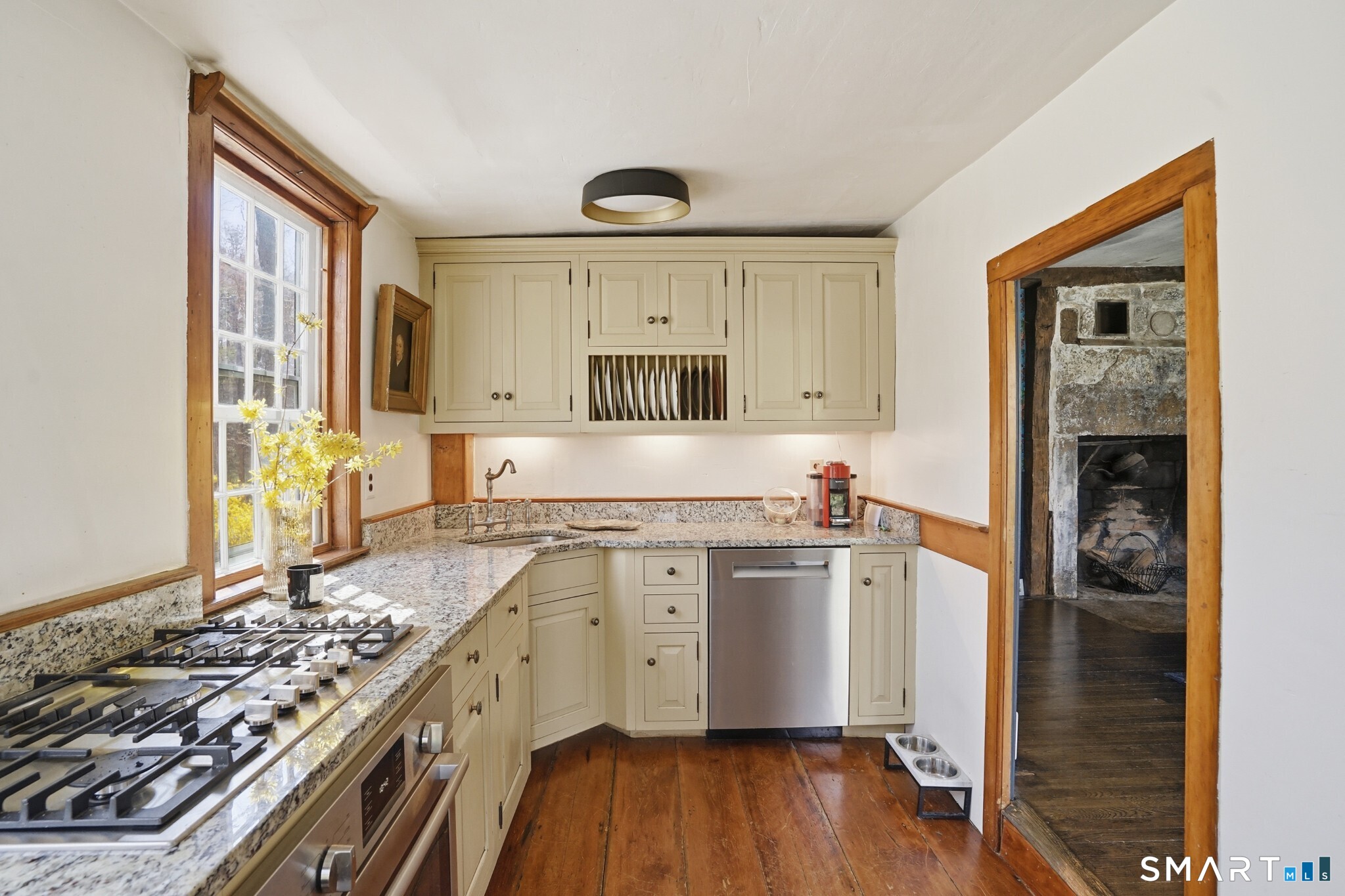 604 Pendleton Hill Road North Stonington, CT 06359 - Photo 16 of 39 a kitchen with a stove a sink and a refrigerator