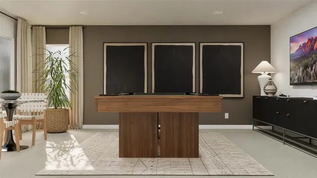 a view of a room with furniture and wooden floor