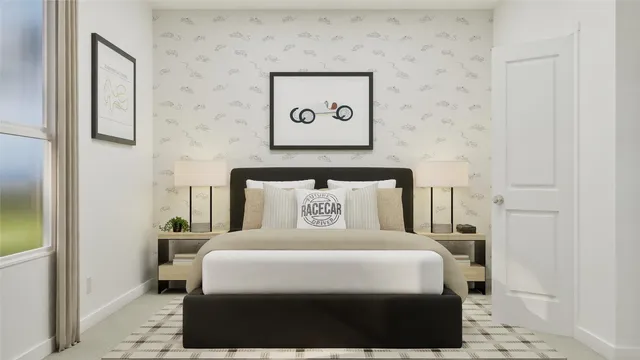 a bed sitting in a bedroom next to a bathroom