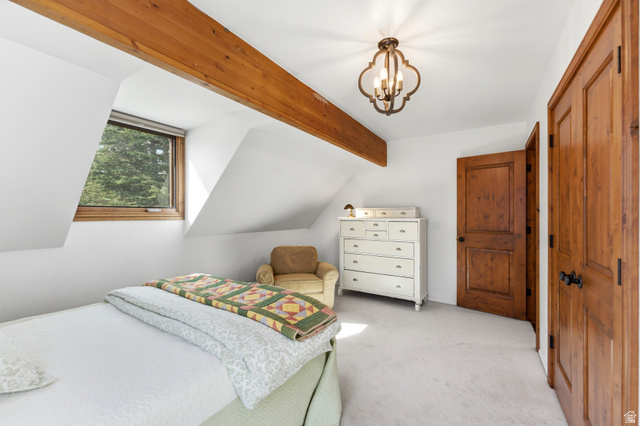 2635 Little Kate Road, Unit 21 Park City, UT 84060 - Photo 32 of 39 Bedroom with carpet, suspended lighting, a closet, and beam ceiling