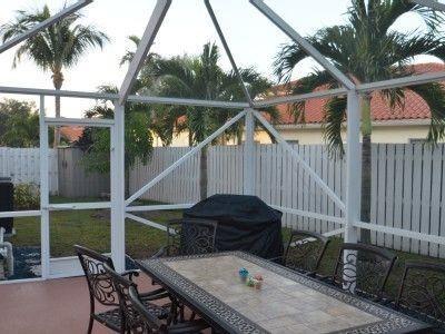 6563 Constance Street, Unit 6563 Lake Worth, FL 33467 - Photo 12 of 16 a view of backyard with outdoor seating and plants