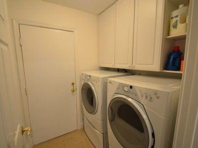 6563 Constance Street, Unit 6563 Lake Worth, FL 33467 - Photo 16 of 16 a utility room with dryer and washer