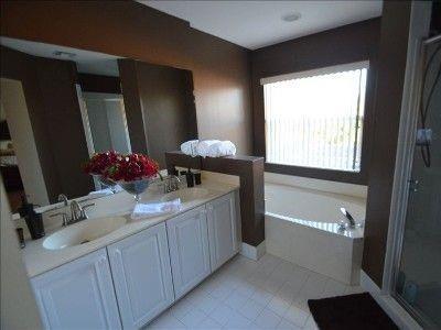 6563 Constance Street, Unit 6563 Lake Worth, FL 33467 - Photo 2 of 16 a bathroom with a sink and a mirror