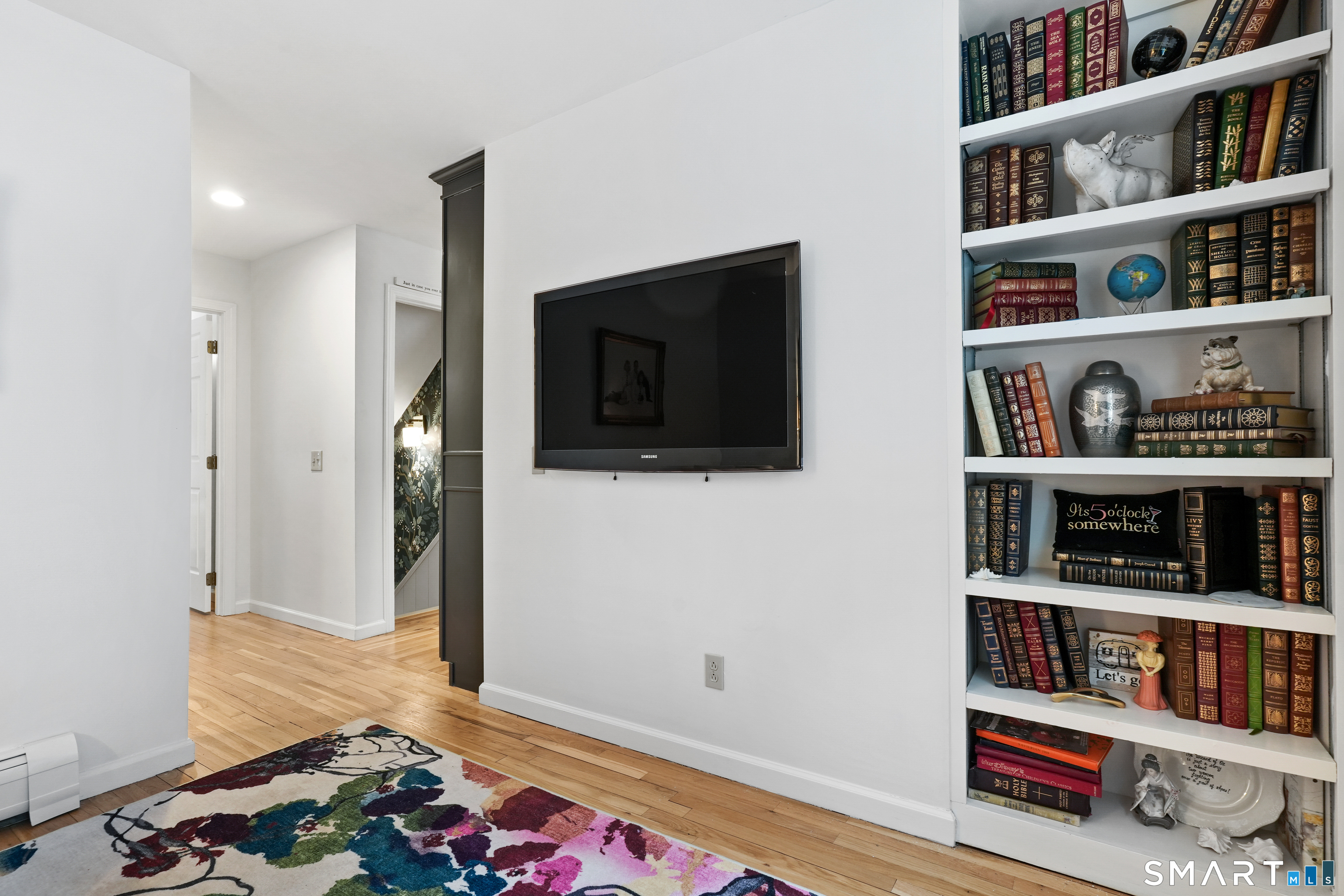 26 Abbott Avenue Ridgefield, CT 06877 - Photo 11 of 34 a living room with lots of books and a book shelf