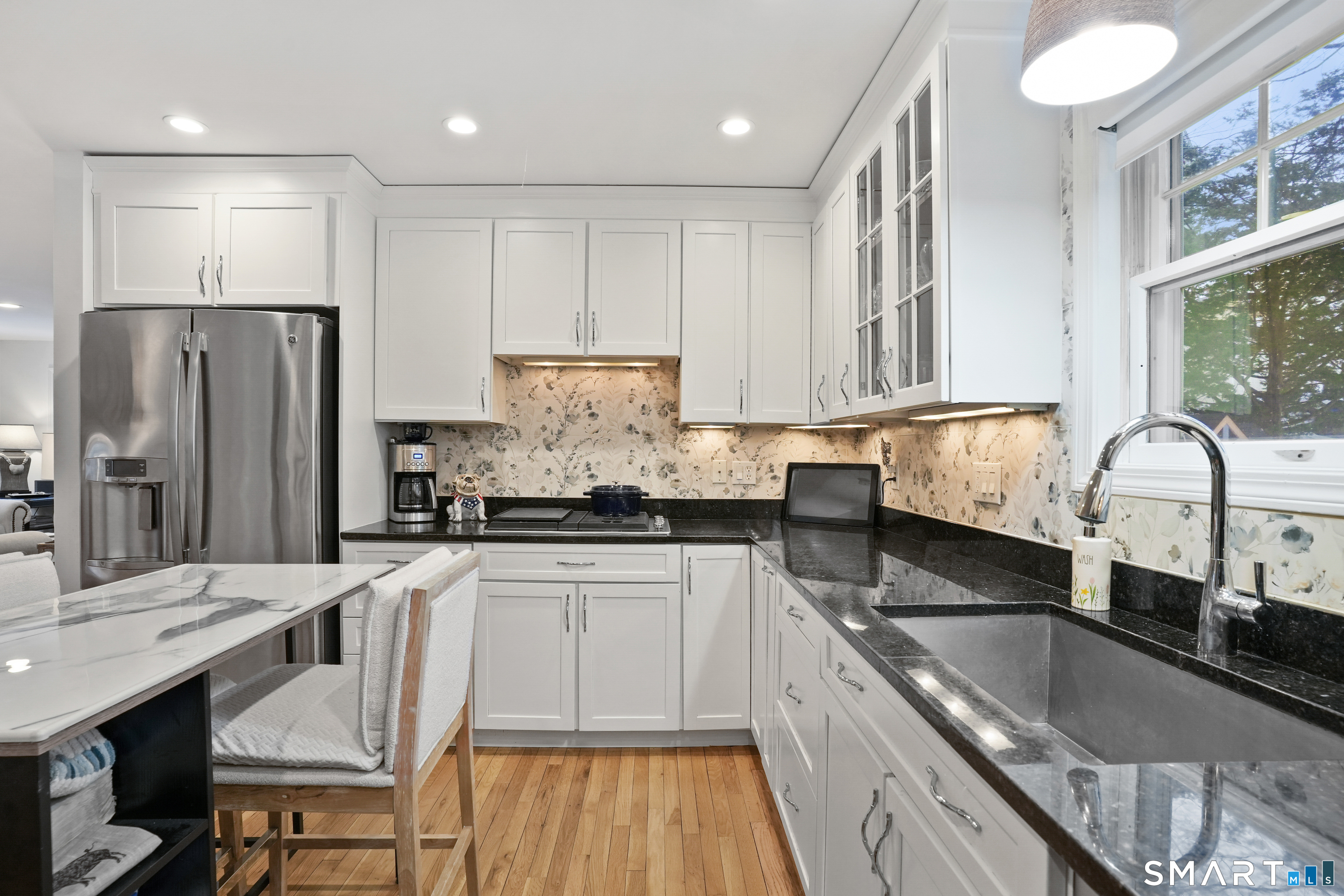 26 Abbott Avenue Ridgefield, CT 06877 - Photo 12 of 34 a kitchen with stainless steel appliances granite countertop a sink refrigerator and cabinets