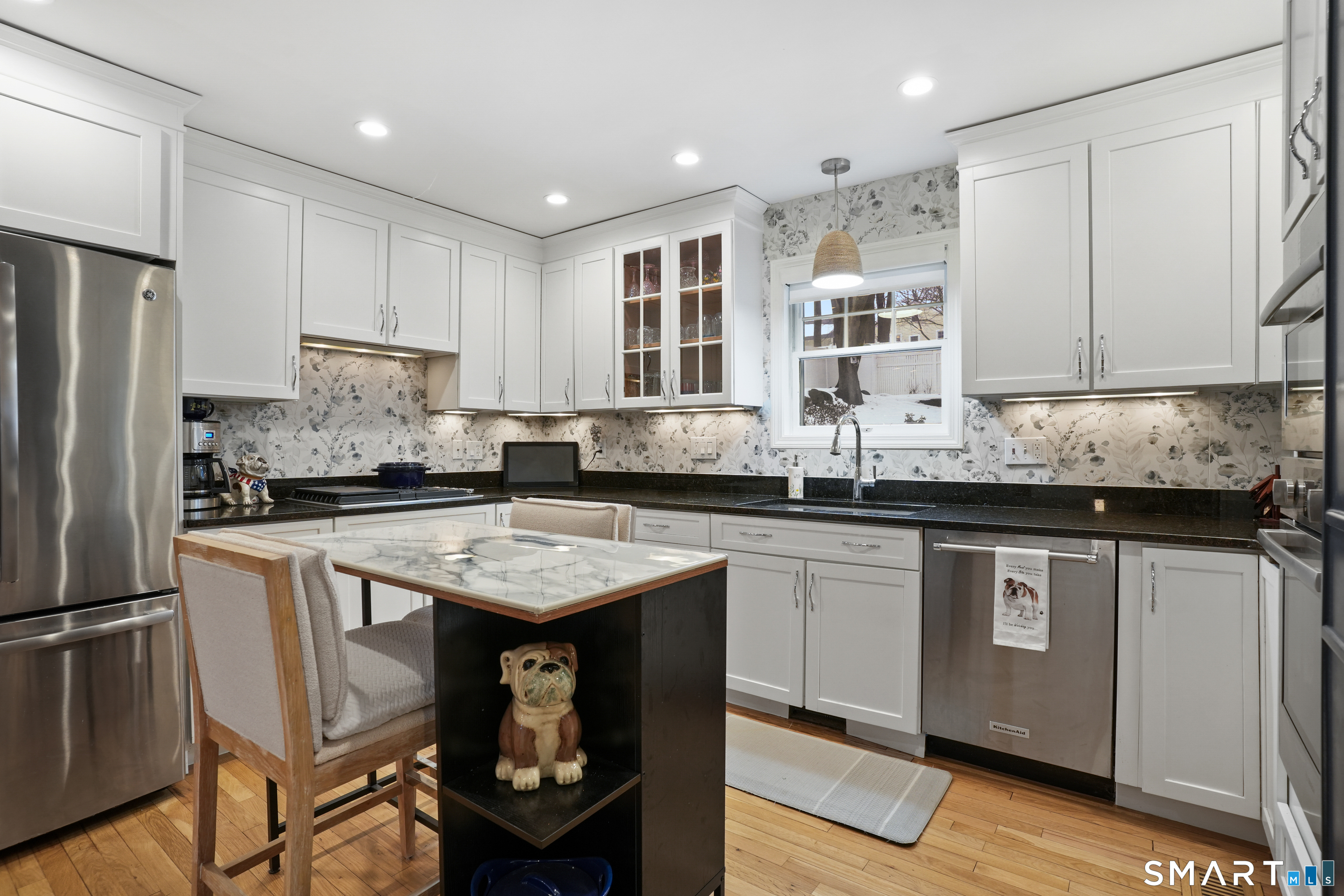 26 Abbott Avenue Ridgefield, CT 06877 - Photo 13 of 34 a kitchen with stainless steel appliances granite countertop a sink stove and refrigerator