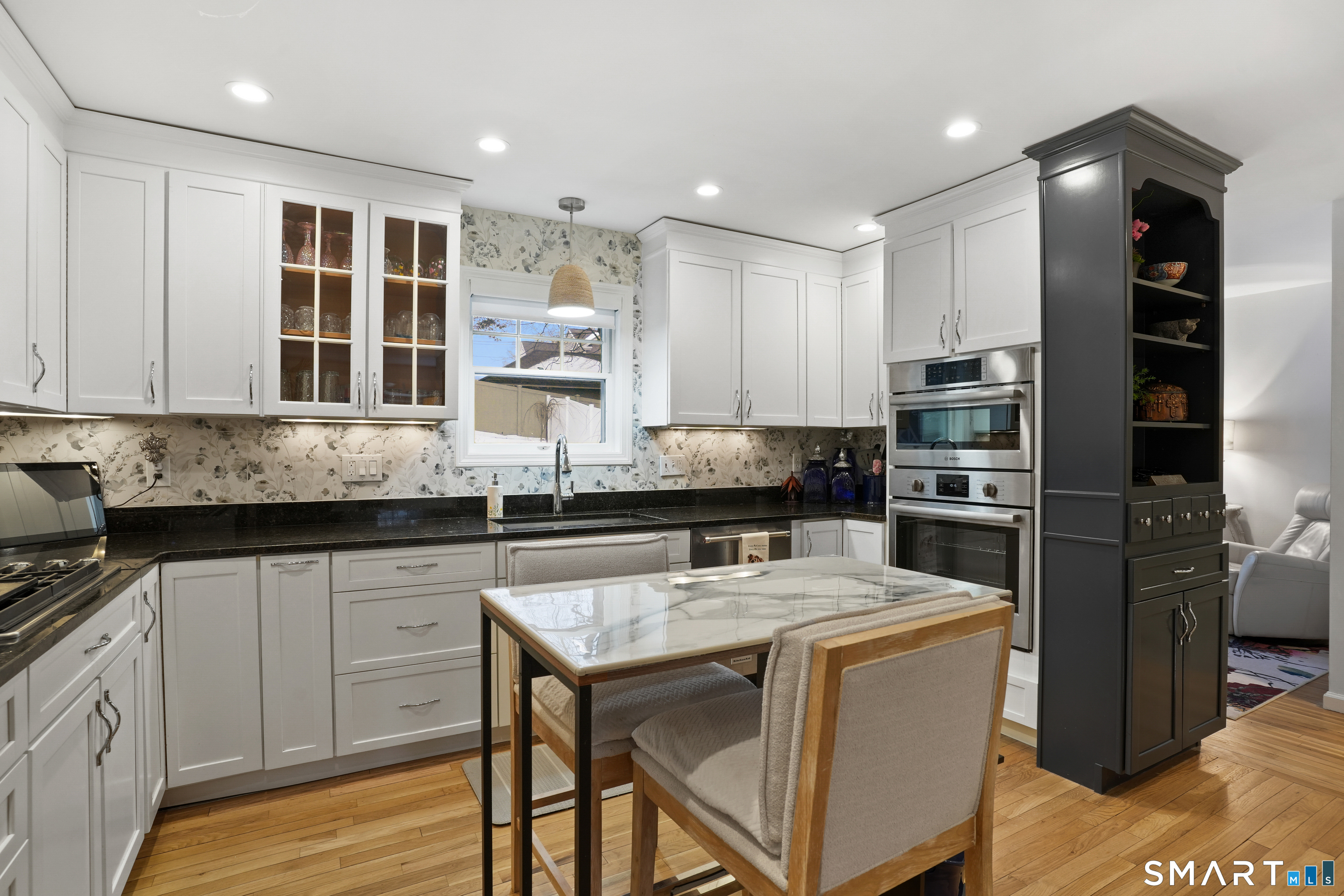 26 Abbott Avenue Ridgefield, CT 06877 - Photo 15 of 34 a kitchen with kitchen island granite countertop a sink cabinets and stainless steel appliances