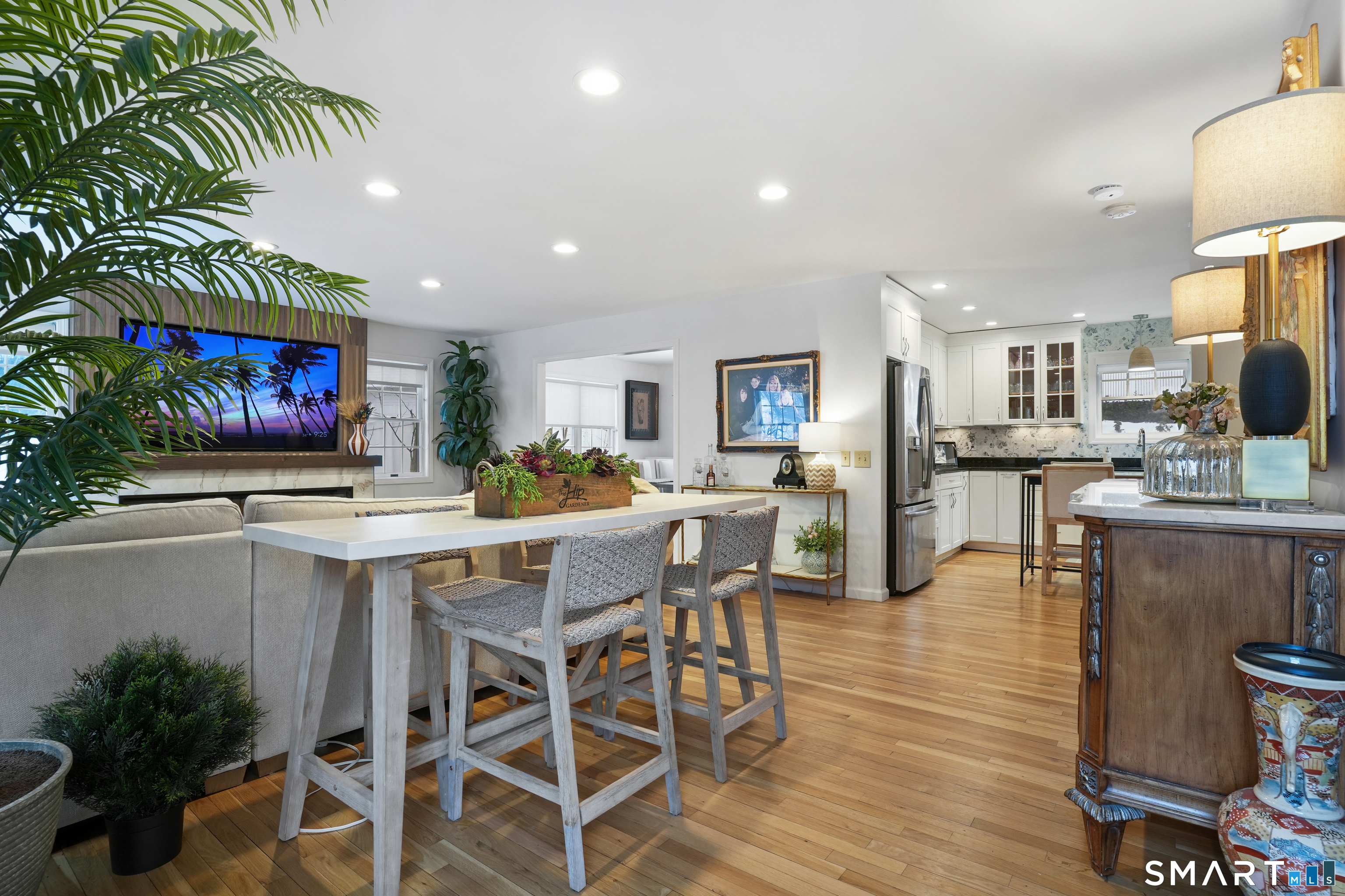 26 Abbott Avenue Ridgefield, CT 06877 - Photo 17 of 34 a kitchen with stainless steel appliances kitchen island granite countertop a table and chairs in it