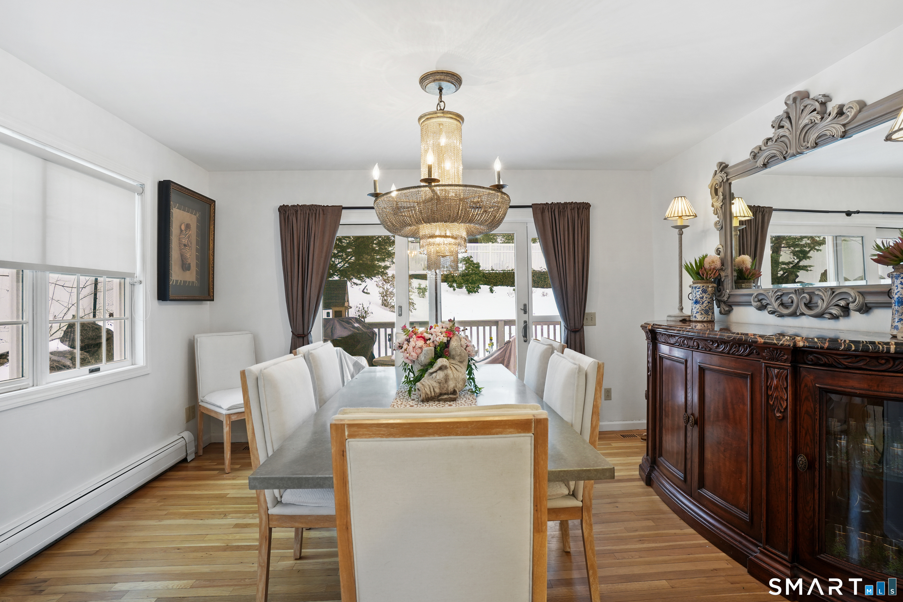 26 Abbott Avenue Ridgefield, CT 06877 - Photo 20 of 34 a view of a dining room with furniture a chandelier and wooden floor