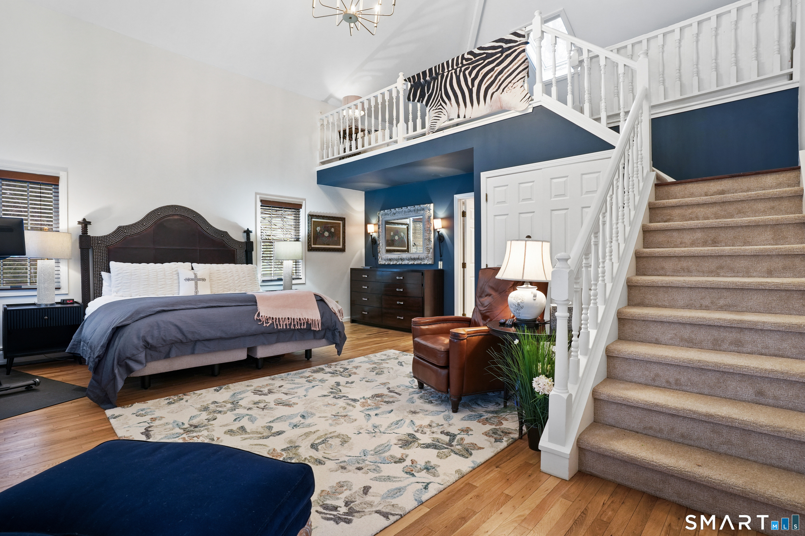 26 Abbott Avenue Ridgefield, CT 06877 - Photo 25 of 34 a bedroom with a bed and a chandelier