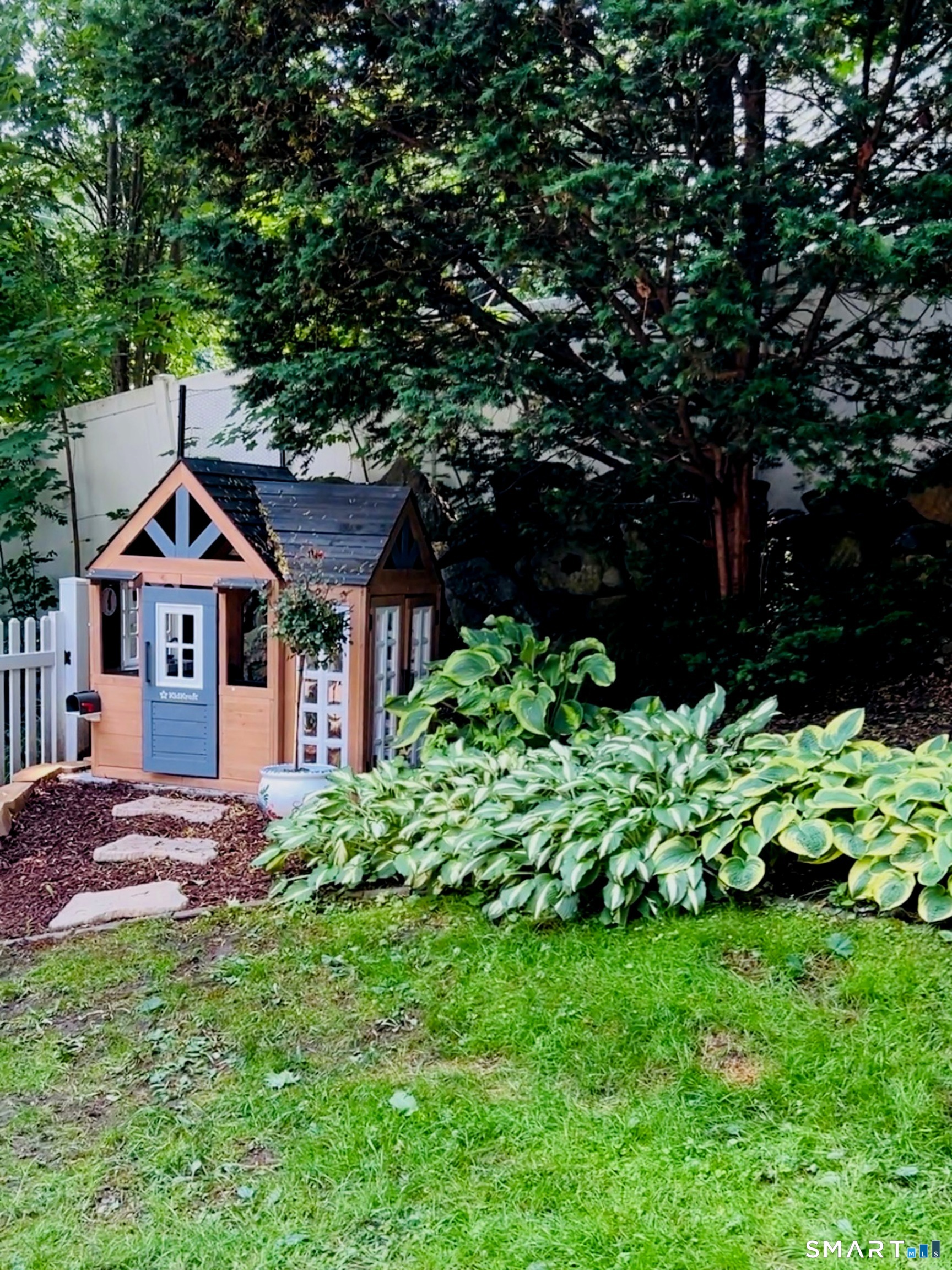 26 Abbott Avenue Ridgefield, CT 06877 - Photo 33 of 34 a front view of a house with a yard