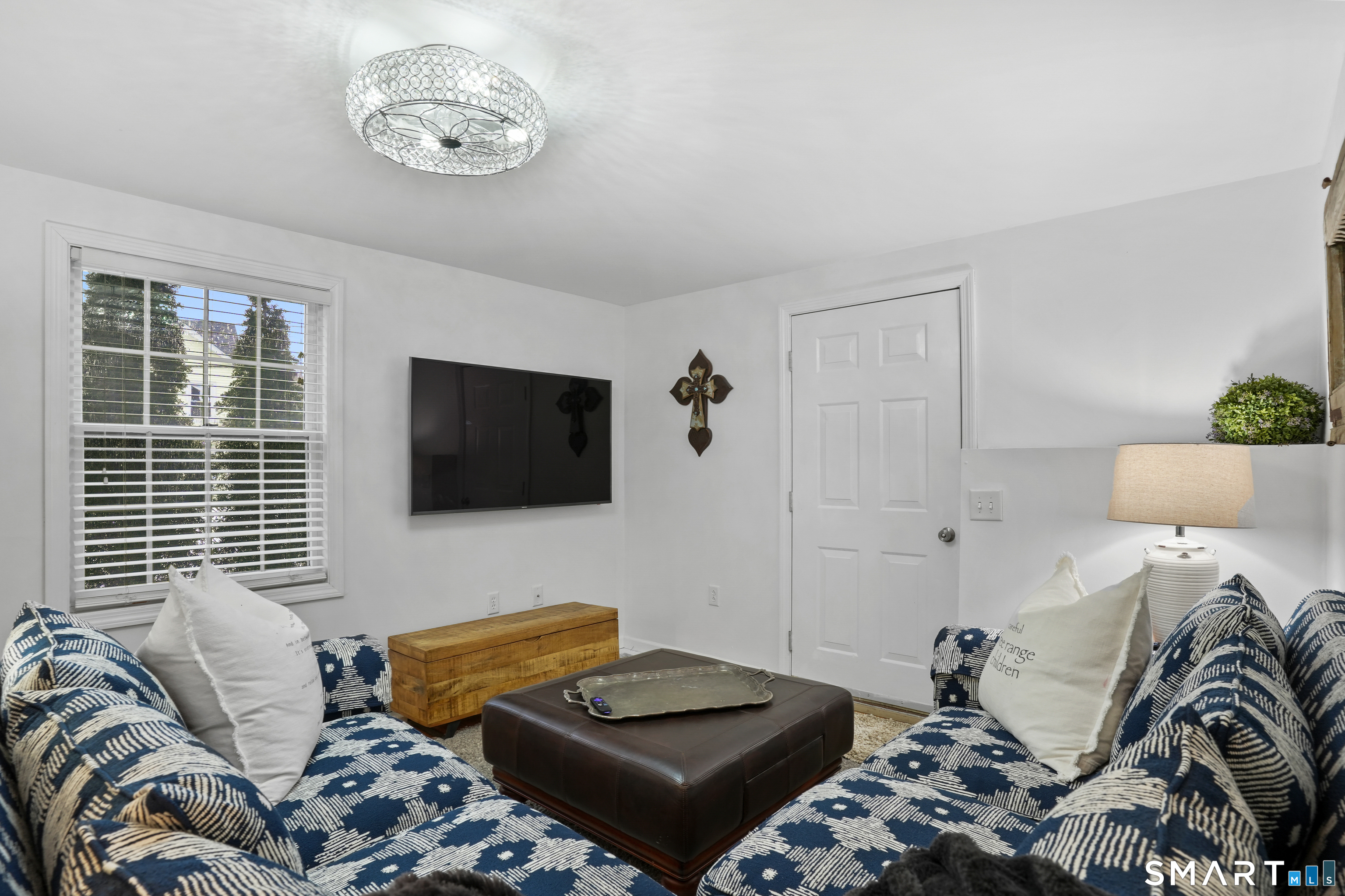 26 Abbott Avenue Ridgefield, CT 06877 - Photo 5 of 34 a bedroom with a bed and a television