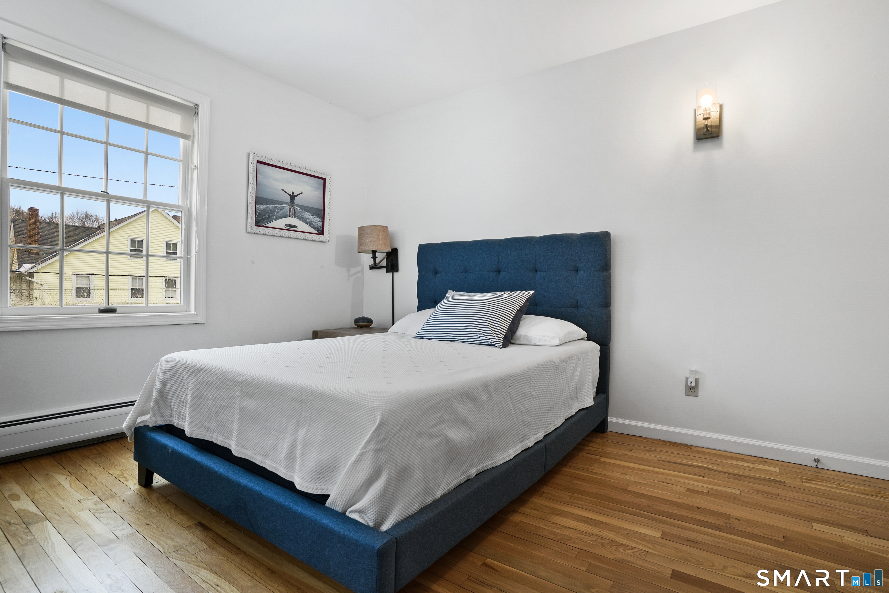 26 Abbott Avenue Ridgefield, CT 06877 - Photo 8 of 34 a bed sitting in a bedroom next to a window