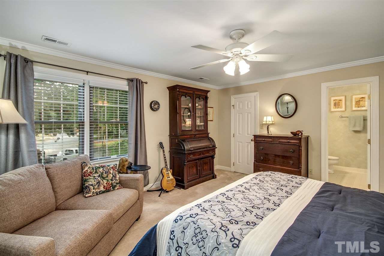 566 Weathergreen Drive Raleigh, NC 27615 - Photo 15 of 28 a living room with furniture and a fireplace