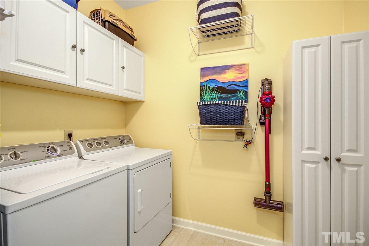 566 Weathergreen Drive Raleigh, NC 27615 - Photo 23 of 28 a utility room with dryer and washer