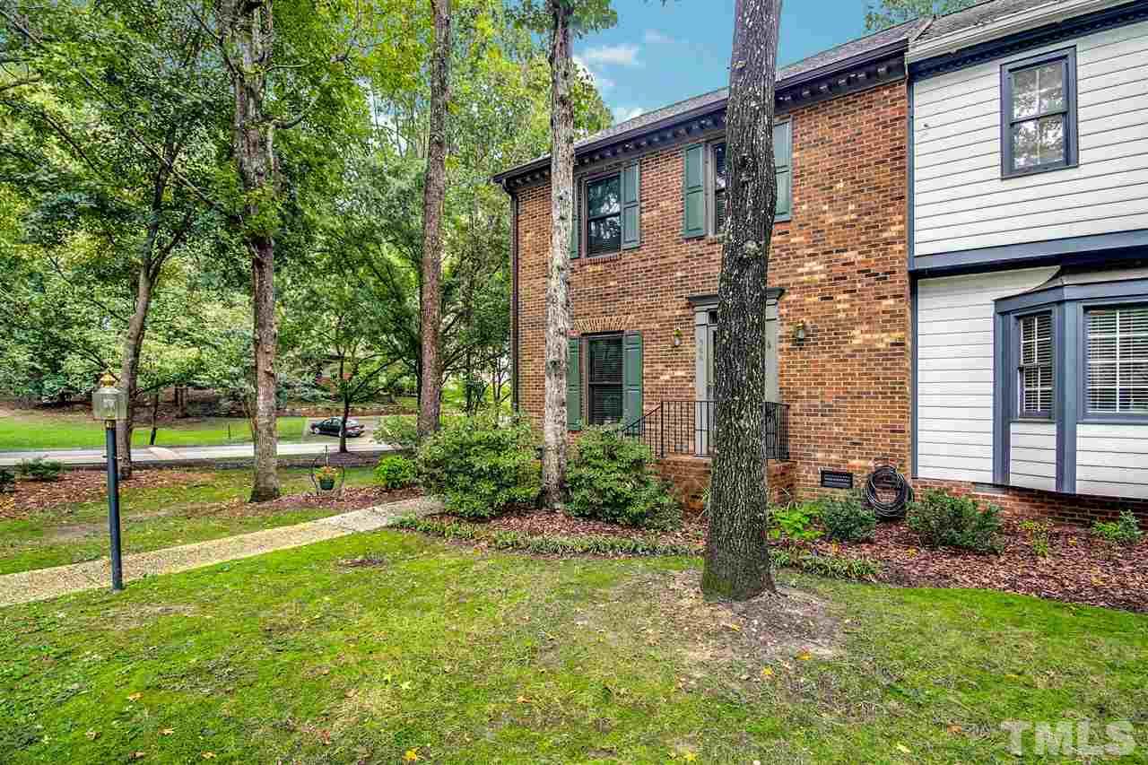 566 Weathergreen Drive Raleigh, NC 27615 - Photo 4 of 28 a view of a house with backyard and a tree