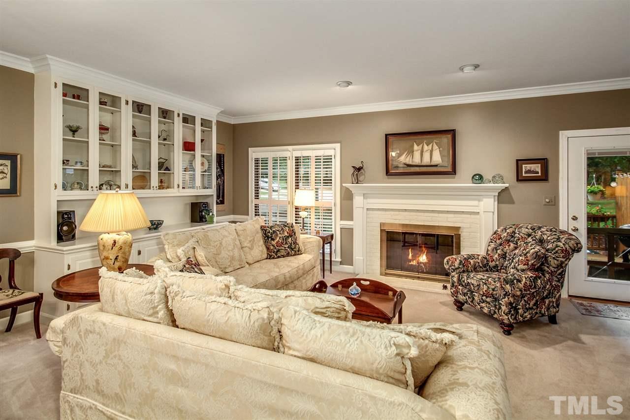 566 Weathergreen Drive Raleigh, NC 27615 - Photo 9 of 28 a living room with furniture and a fireplace
