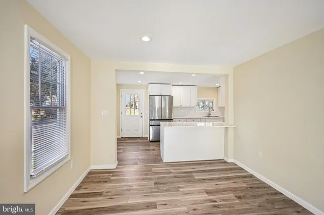 a view of kitchen with wooden floor