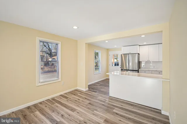 a view of a kitchen cabinets and wooden floor