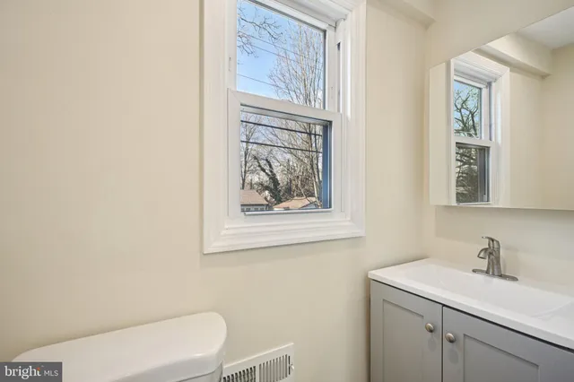 a view of a bathroom from a hallway