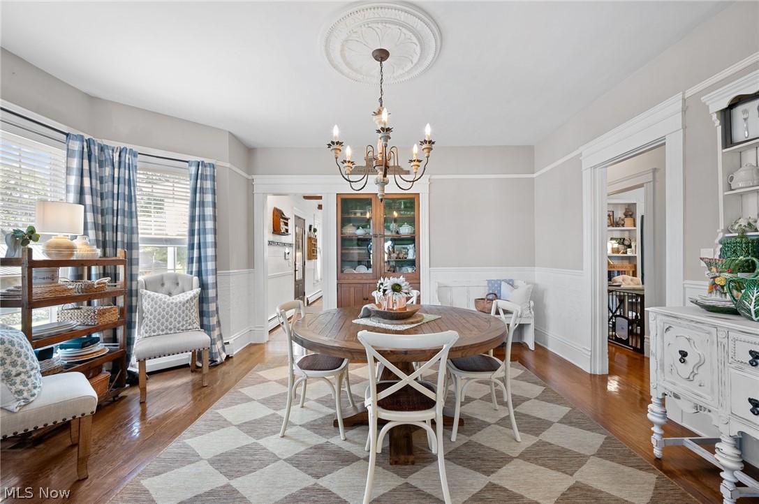 5656 Avon Belden Road North Ridgeville, OH 44039 - Photo 12 of 50 Dining room featuring a notable chandelier and light wood-type flooring
