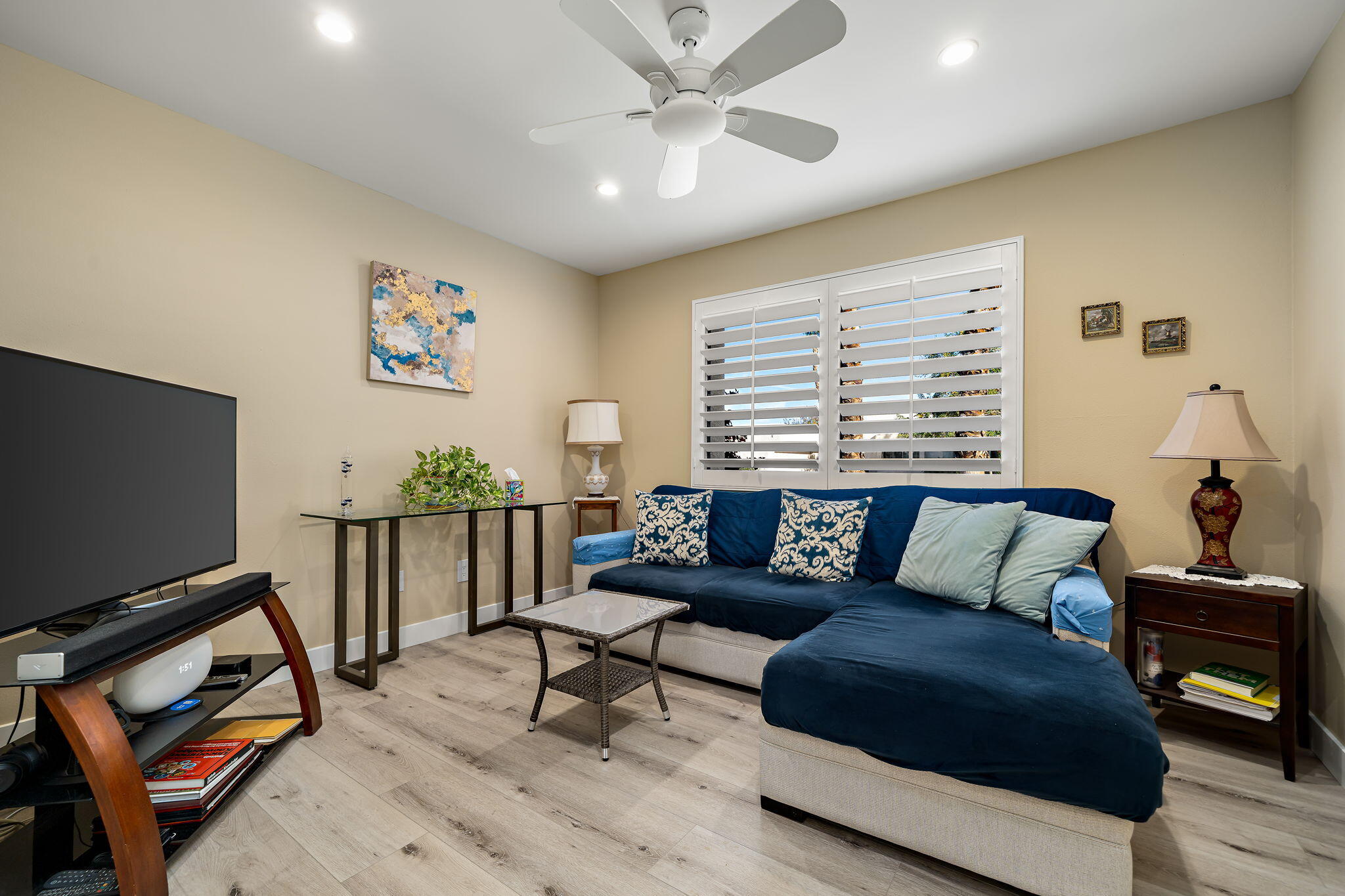 255 Vía Rengo Palm Desert, CA 92260 - Photo 13 of 32 a living room with furniture and a flat screen tv