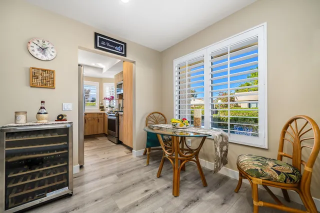 a kitchen with a stove a sink and a window