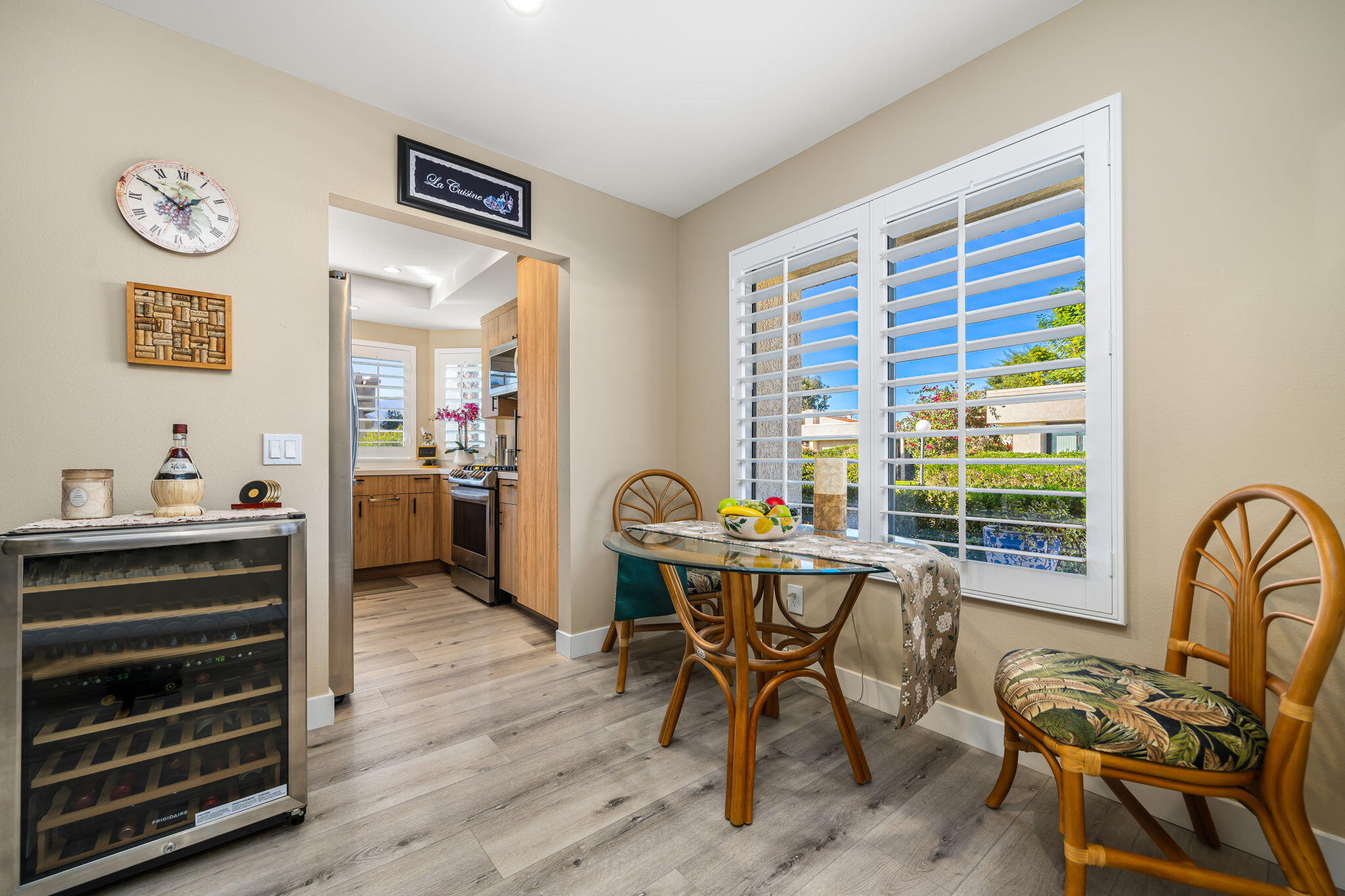 255 Vía Rengo Palm Desert, CA 92260 - Photo 14 of 32 a workspace with furniture window and wooden floor