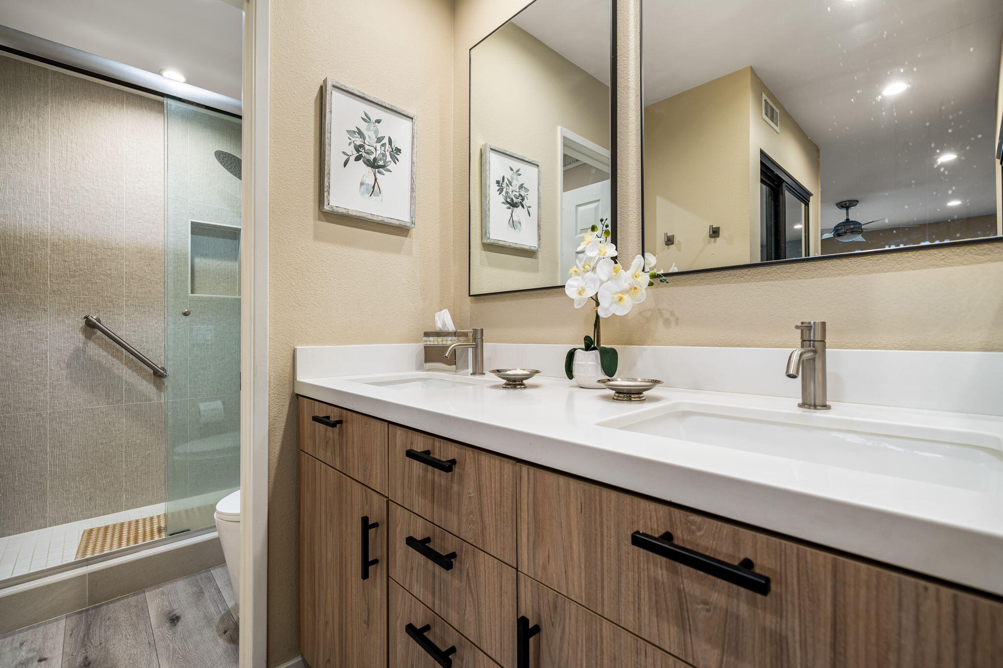 255 Vía Rengo Palm Desert, CA 92260 - Photo 21 of 32 a bathroom with a double vanity sink and a mirror
