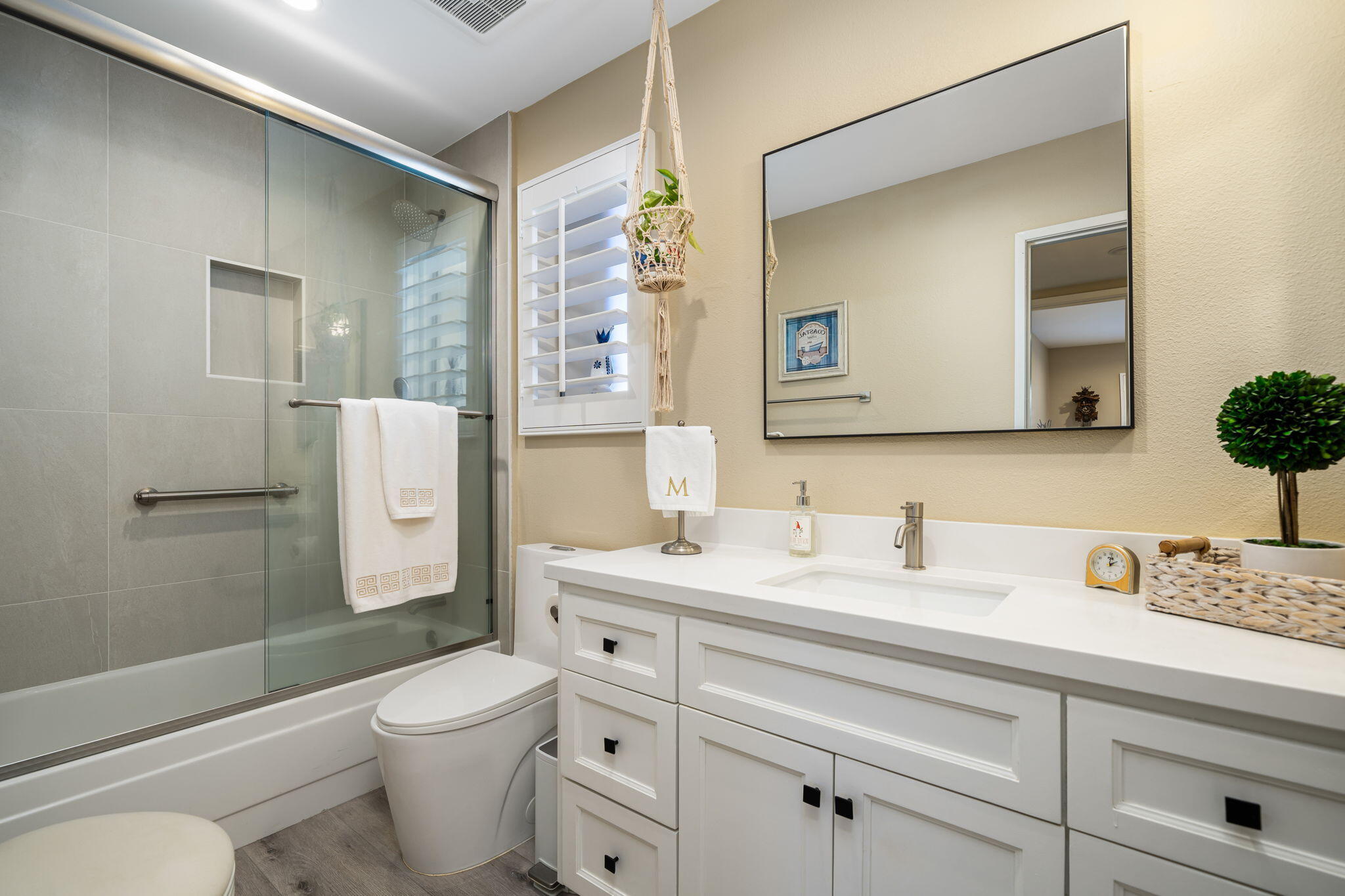 255 Vía Rengo Palm Desert, CA 92260 - Photo 22 of 32 a bathroom with a toilet sink vanity granite and mirror
