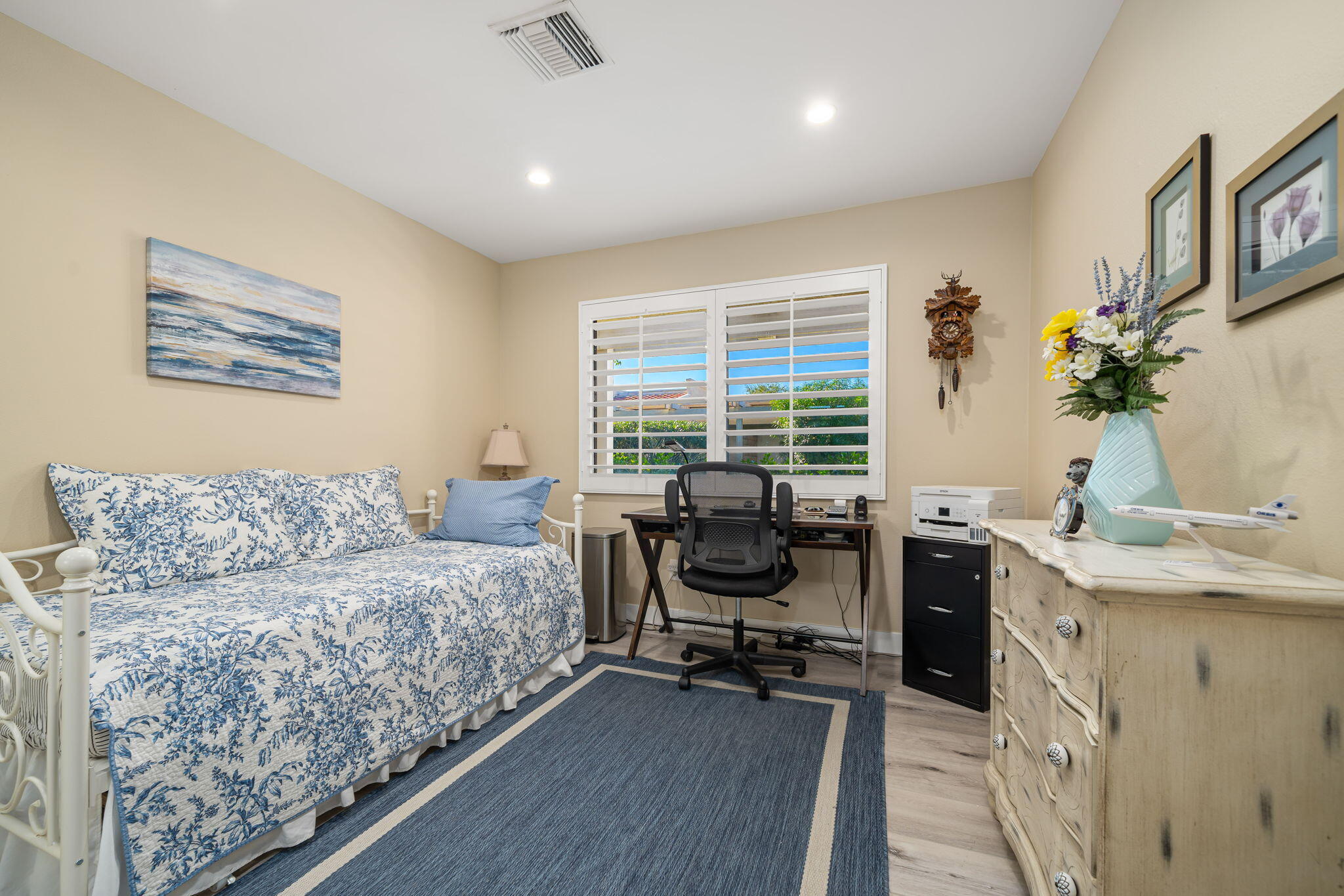 255 Vía Rengo Palm Desert, CA 92260 - Photo 23 of 32 a view of a livingroom with workspace and a window