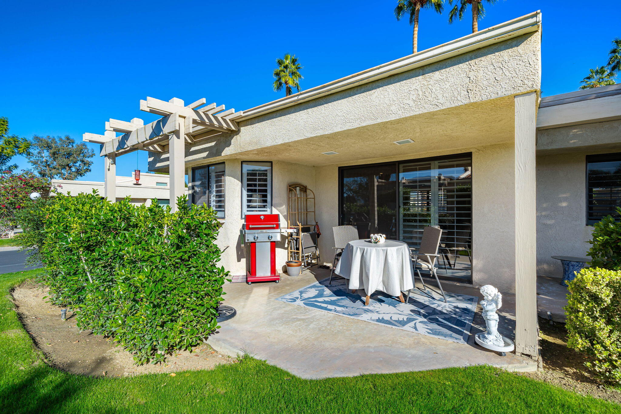 255 Vía Rengo Palm Desert, CA 92260 - Photo 27 of 32 a front view of a house with porch
