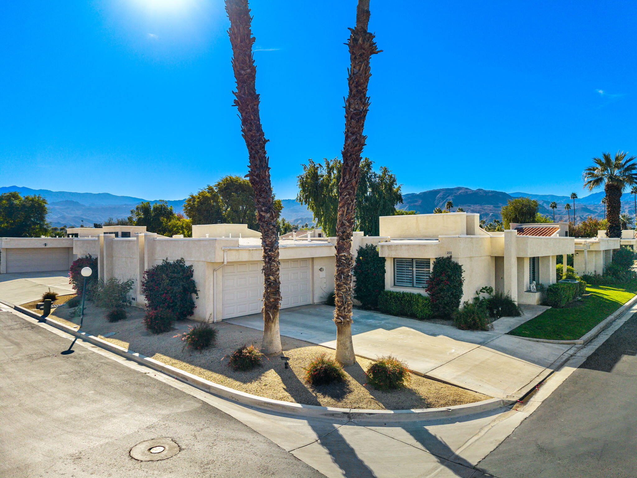 255 Vía Rengo Palm Desert, CA 92260 - Photo 4 of 32 a view of a house with backyard and tree