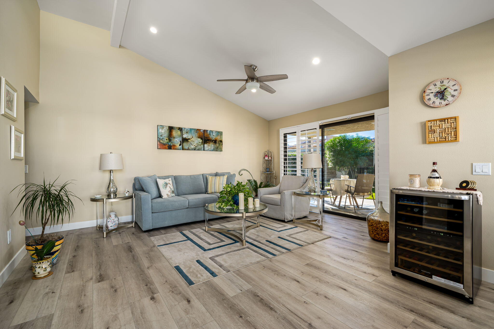 255 Vía Rengo Palm Desert, CA 92260 - Photo 9 of 32 a living room with furniture and wooden floor