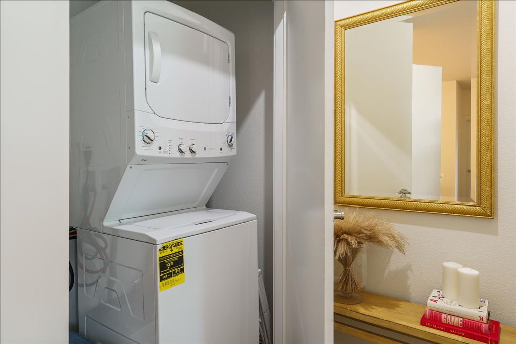 1900 Barton Springs Road, Unit 4029 Austin, TX 78704 - Photo 8 of 21 An efficient laundry closet features a stacked washer and dryer unit.