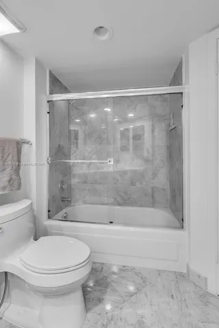 a bathroom with a shower and a toilet