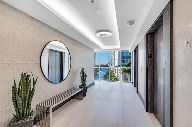 a view of a balcony with two chairs and a table